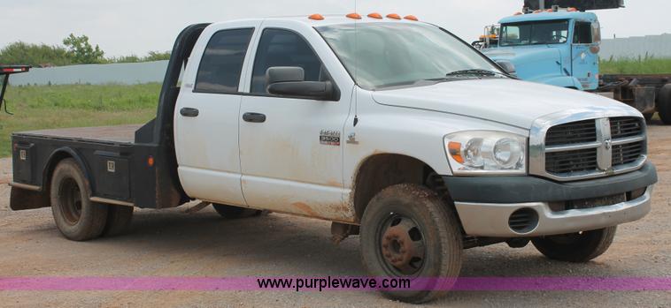 image for item K8885 2007 Dodge Ram 3500HD SLT Quad Cab flatbed pickup truck