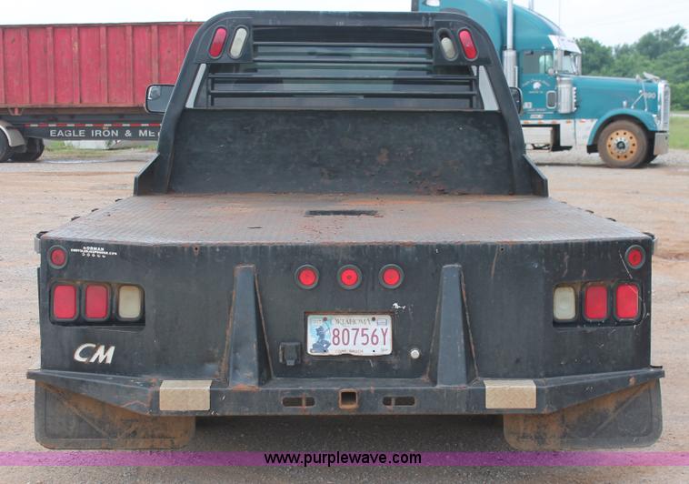 image for item K8885 2007 Dodge Ram 3500HD SLT Quad Cab flatbed pickup truck