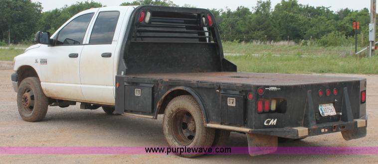 image for item K8885 2007 Dodge Ram 3500HD SLT Quad Cab flatbed pickup truck