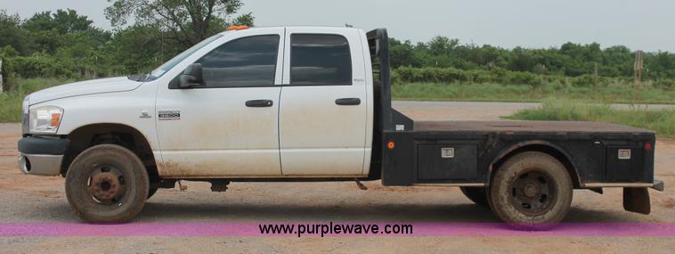 image for item K8885 2007 Dodge Ram 3500HD SLT Quad Cab flatbed pickup truck