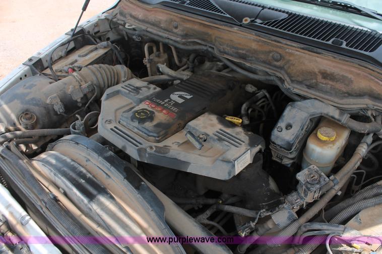 image for item K8885 2007 Dodge Ram 3500HD SLT Quad Cab flatbed pickup truck