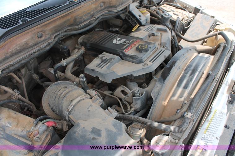 image for item K8885 2007 Dodge Ram 3500HD SLT Quad Cab flatbed pickup truck