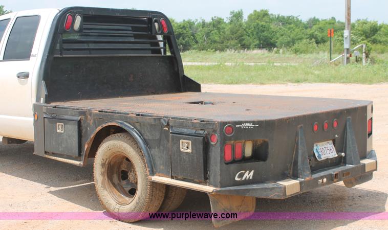 image for item K8885 2007 Dodge Ram 3500HD SLT Quad Cab flatbed pickup truck