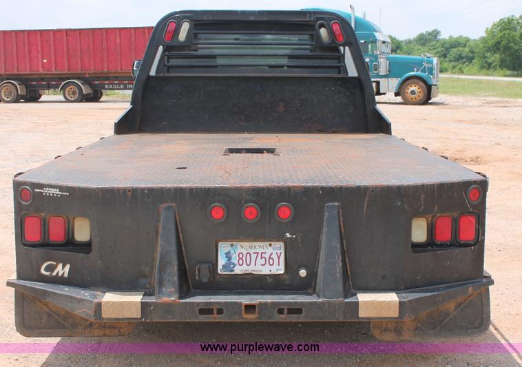 image for item K8885 2007 Dodge Ram 3500HD SLT Quad Cab flatbed pickup truck