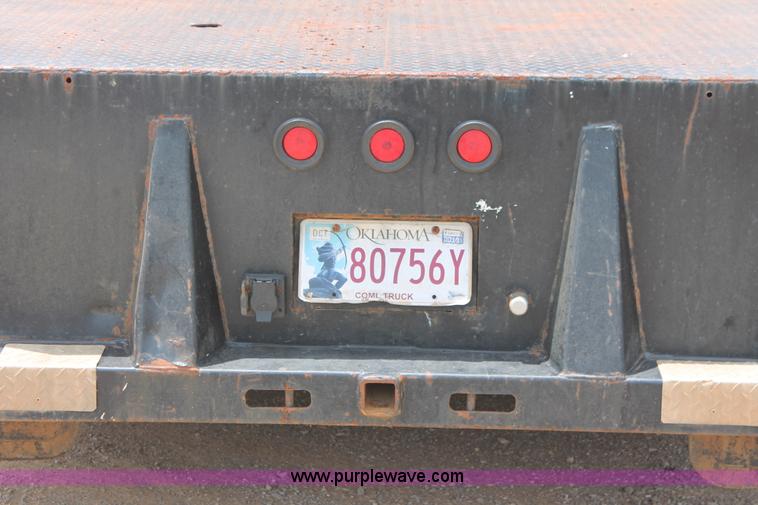 image for item K8885 2007 Dodge Ram 3500HD SLT Quad Cab flatbed pickup truck