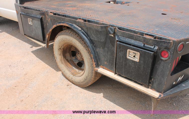 image for item K8885 2007 Dodge Ram 3500HD SLT Quad Cab flatbed pickup truck