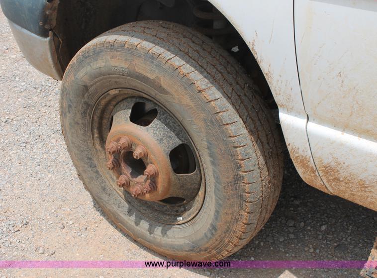 image for item K8885 2007 Dodge Ram 3500HD SLT Quad Cab flatbed pickup truck