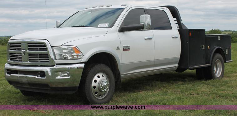 image for item K8910 2012 Dodge Ram 3500HD Laramie Quad Cab flatbed pickup truck