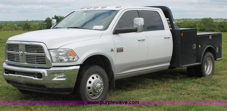 image for item K8910 2012 Dodge Ram 3500HD Laramie Quad Cab flatbed pickup truck