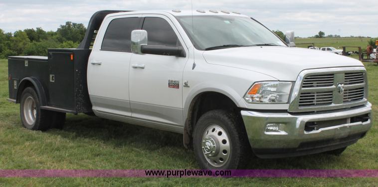 image for item K8910 2012 Dodge Ram 3500HD Laramie Quad Cab flatbed pickup truck
