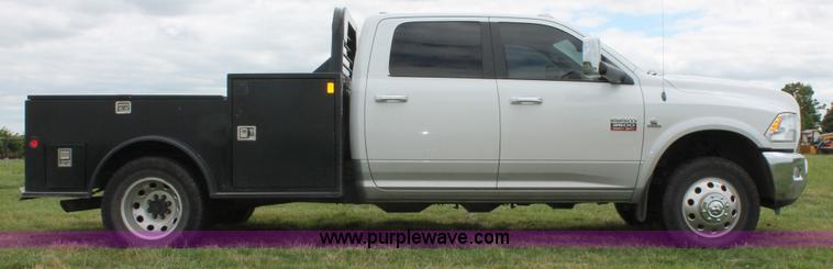 image for item K8910 2012 Dodge Ram 3500HD Laramie Quad Cab flatbed pickup truck