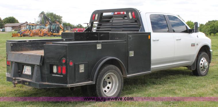 image for item K8910 2012 Dodge Ram 3500HD Laramie Quad Cab flatbed pickup truck