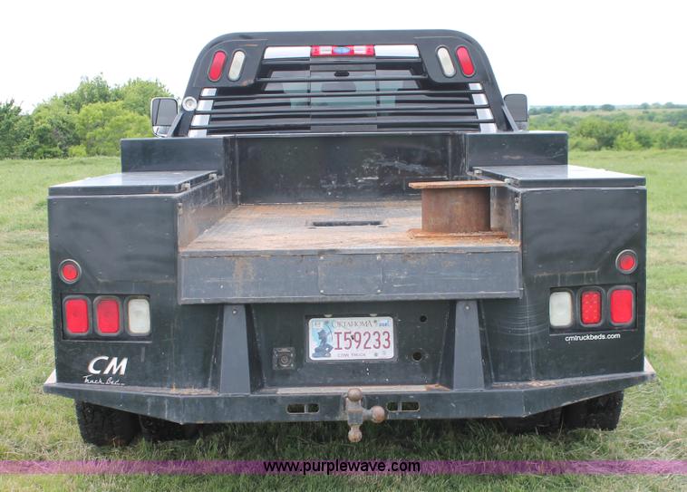 image for item K8910 2012 Dodge Ram 3500HD Laramie Quad Cab flatbed pickup truck