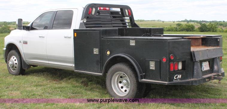 image for item K8910 2012 Dodge Ram 3500HD Laramie Quad Cab flatbed pickup truck