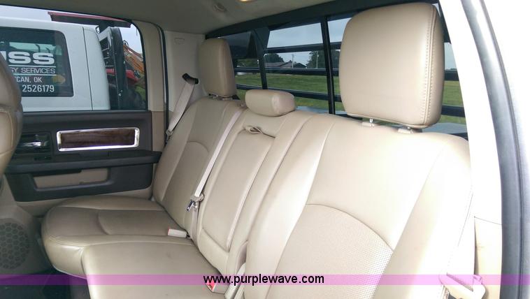 image for item K8910 2012 Dodge Ram 3500HD Laramie Quad Cab flatbed pickup truck