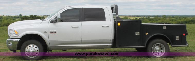 image for item K8910 2012 Dodge Ram 3500HD Laramie Quad Cab flatbed pickup truck