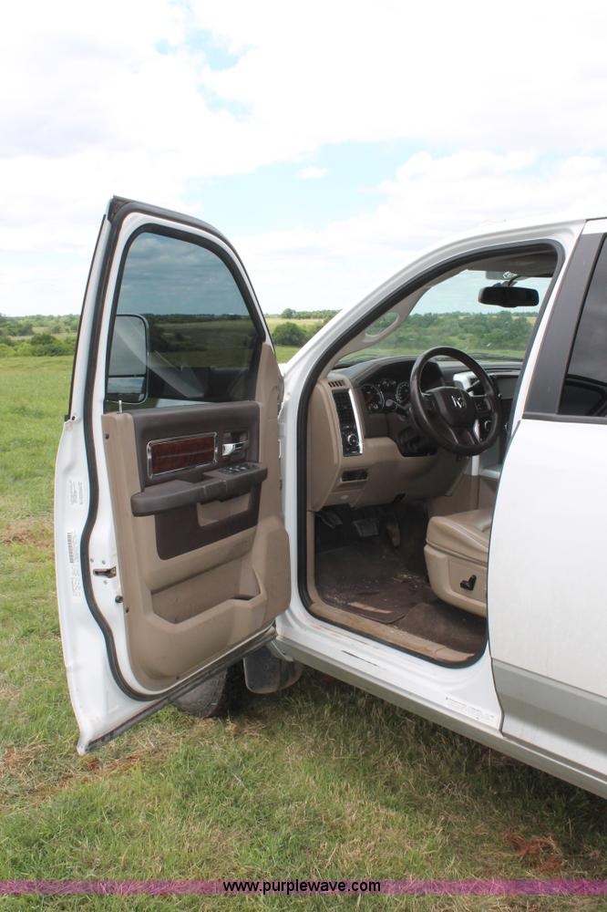 image for item K8910 2012 Dodge Ram 3500HD Laramie Quad Cab flatbed pickup truck