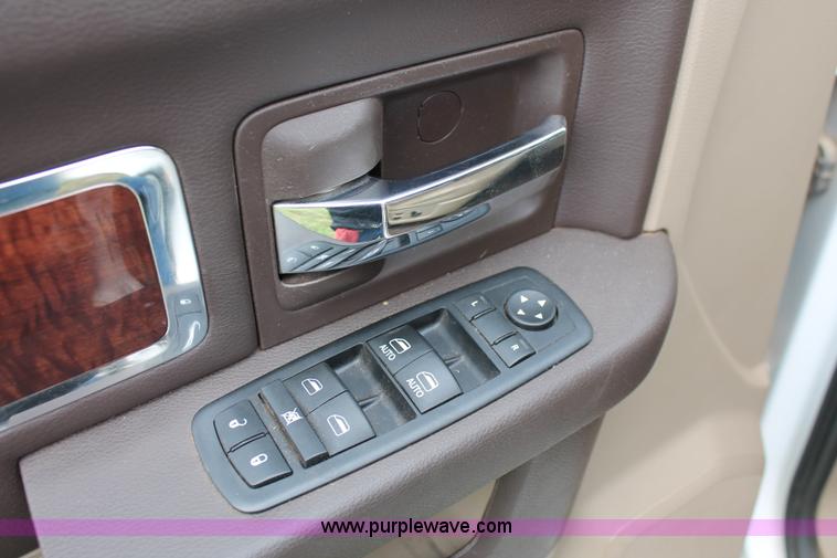 image for item K8910 2012 Dodge Ram 3500HD Laramie Quad Cab flatbed pickup truck