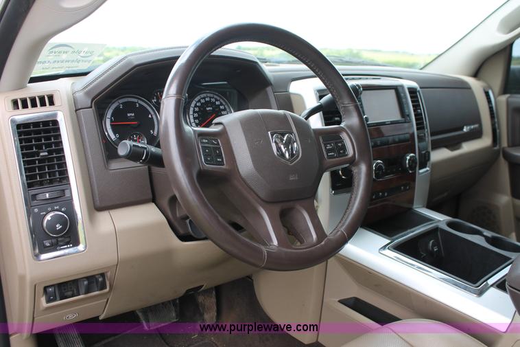 image for item K8910 2012 Dodge Ram 3500HD Laramie Quad Cab flatbed pickup truck