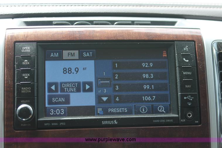 image for item K8910 2012 Dodge Ram 3500HD Laramie Quad Cab flatbed pickup truck