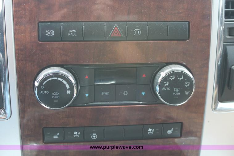 image for item K8910 2012 Dodge Ram 3500HD Laramie Quad Cab flatbed pickup truck