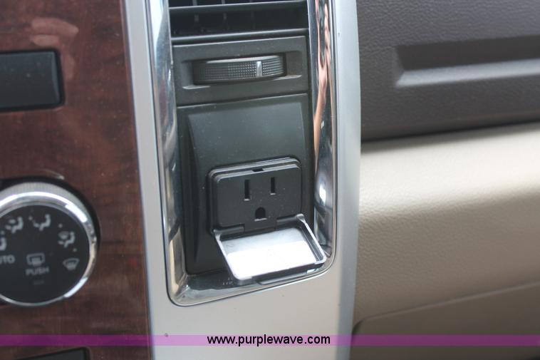 image for item K8910 2012 Dodge Ram 3500HD Laramie Quad Cab flatbed pickup truck