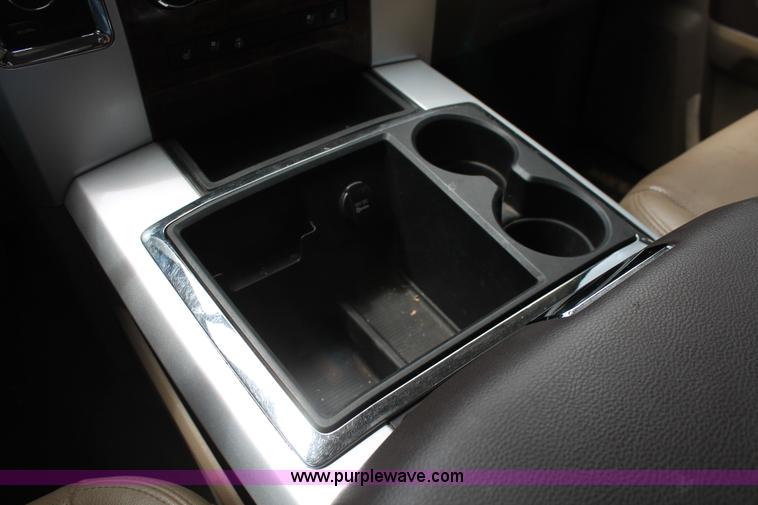 image for item K8910 2012 Dodge Ram 3500HD Laramie Quad Cab flatbed pickup truck