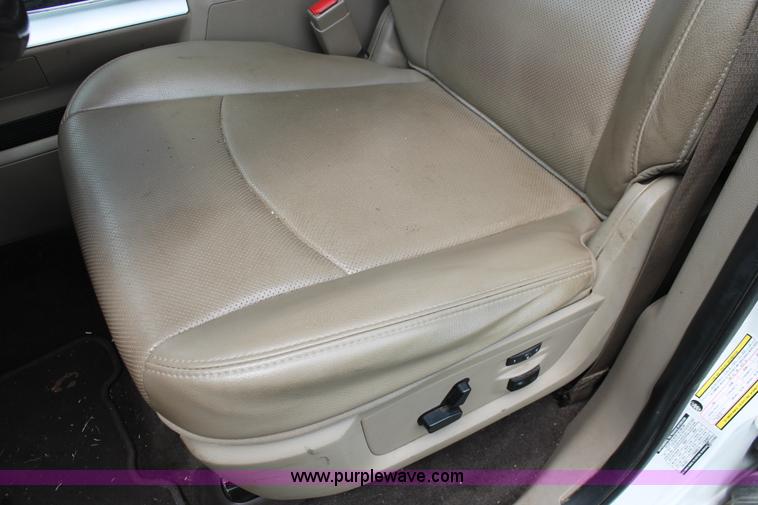 image for item K8910 2012 Dodge Ram 3500HD Laramie Quad Cab flatbed pickup truck