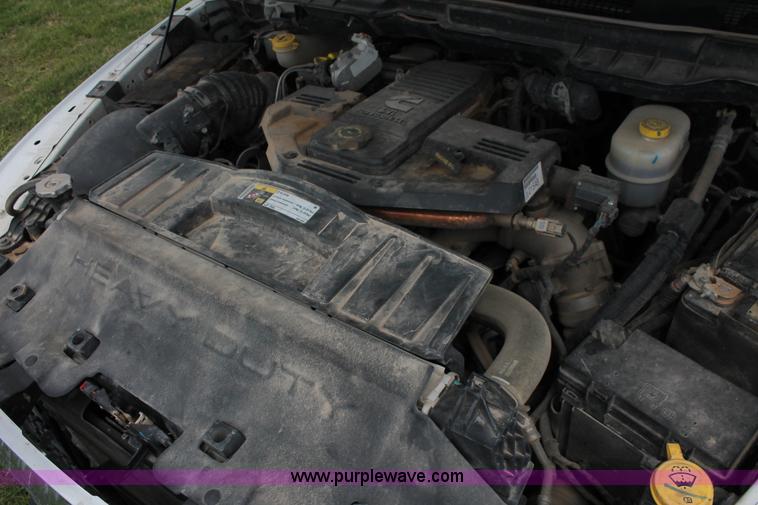 image for item K8910 2012 Dodge Ram 3500HD Laramie Quad Cab flatbed pickup truck