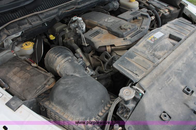 image for item K8910 2012 Dodge Ram 3500HD Laramie Quad Cab flatbed pickup truck