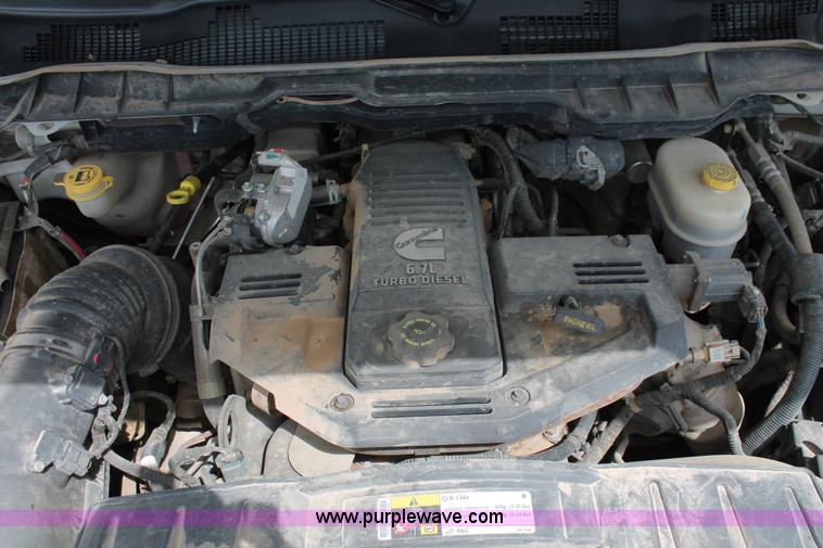 image for item K8910 2012 Dodge Ram 3500HD Laramie Quad Cab flatbed pickup truck