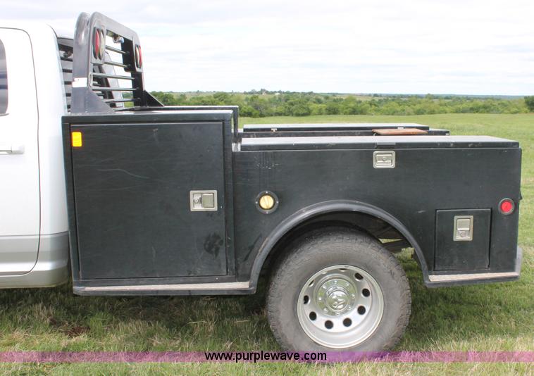 image for item K8910 2012 Dodge Ram 3500HD Laramie Quad Cab flatbed pickup truck