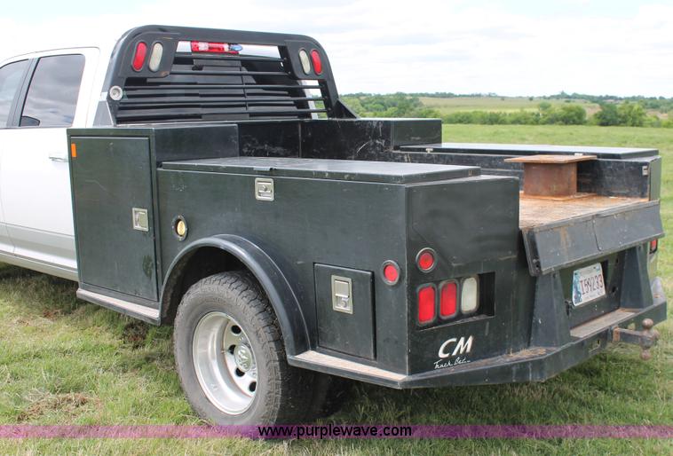 image for item K8910 2012 Dodge Ram 3500HD Laramie Quad Cab flatbed pickup truck