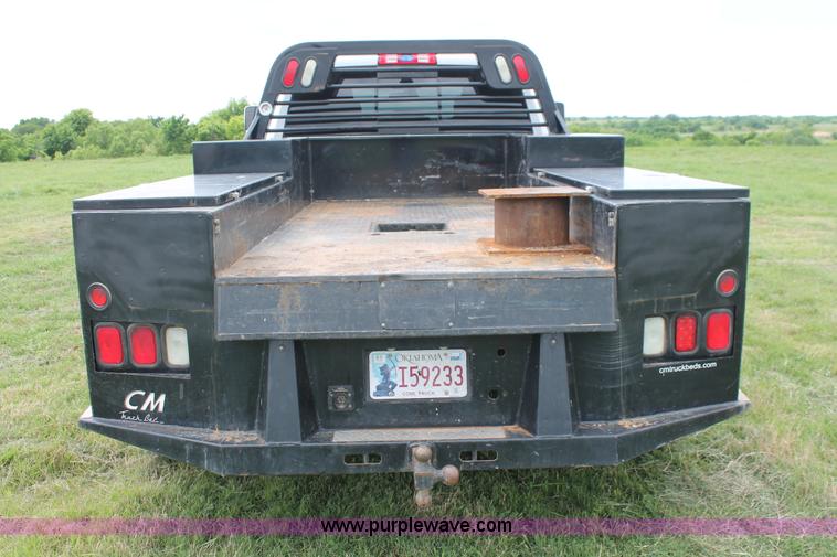 image for item K8910 2012 Dodge Ram 3500HD Laramie Quad Cab flatbed pickup truck