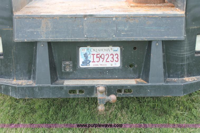 image for item K8910 2012 Dodge Ram 3500HD Laramie Quad Cab flatbed pickup truck