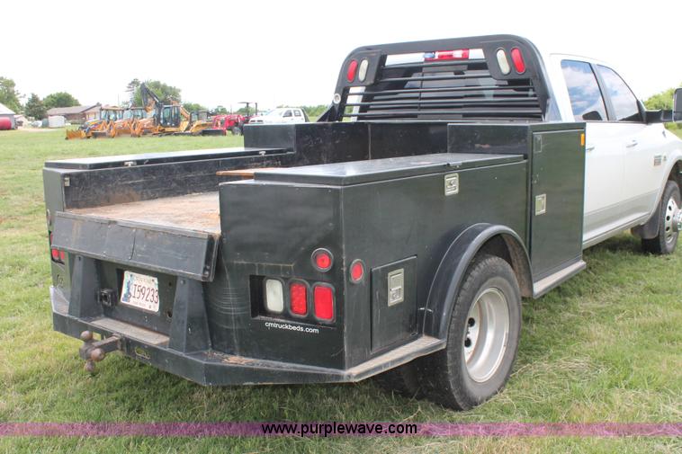 image for item K8910 2012 Dodge Ram 3500HD Laramie Quad Cab flatbed pickup truck