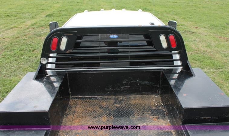 image for item K8910 2012 Dodge Ram 3500HD Laramie Quad Cab flatbed pickup truck