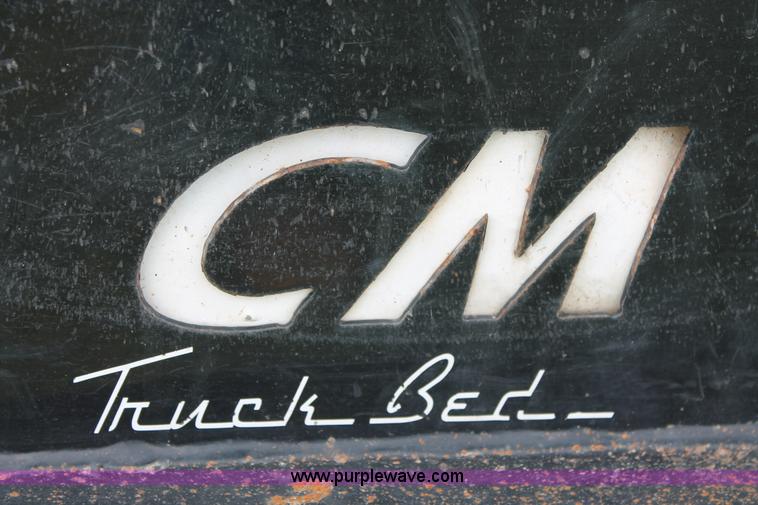 image for item K8910 2012 Dodge Ram 3500HD Laramie Quad Cab flatbed pickup truck