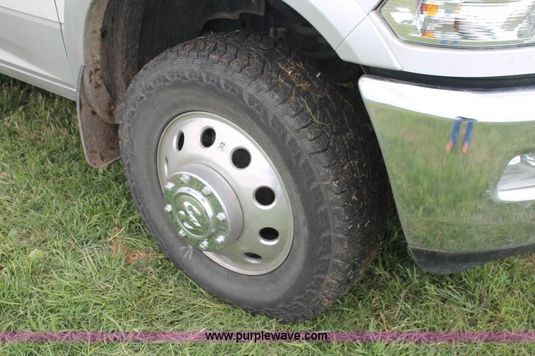 image for item K8910 2012 Dodge Ram 3500HD Laramie Quad Cab flatbed pickup truck