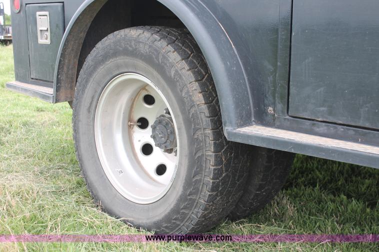 image for item K8910 2012 Dodge Ram 3500HD Laramie Quad Cab flatbed pickup truck