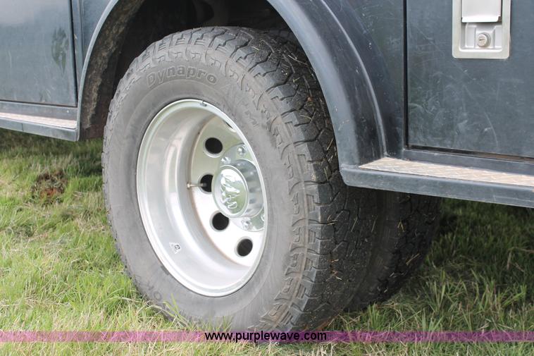 image for item K8910 2012 Dodge Ram 3500HD Laramie Quad Cab flatbed pickup truck