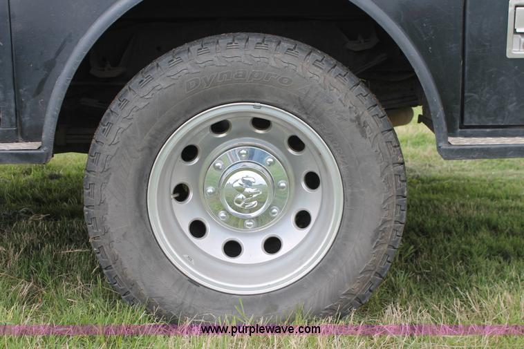 image for item K8910 2012 Dodge Ram 3500HD Laramie Quad Cab flatbed pickup truck