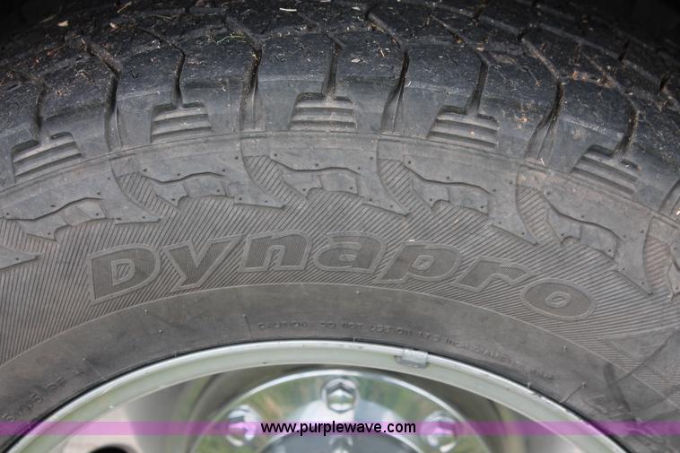 image for item K8910 2012 Dodge Ram 3500HD Laramie Quad Cab flatbed pickup truck