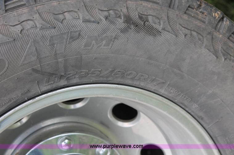 image for item K8910 2012 Dodge Ram 3500HD Laramie Quad Cab flatbed pickup truck