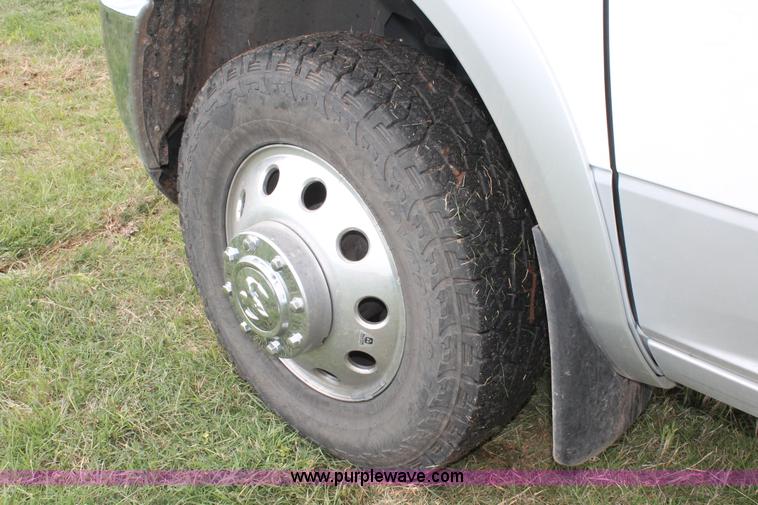 image for item K8910 2012 Dodge Ram 3500HD Laramie Quad Cab flatbed pickup truck