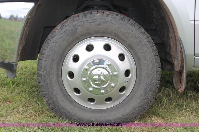 image for item K8910 2012 Dodge Ram 3500HD Laramie Quad Cab flatbed pickup truck