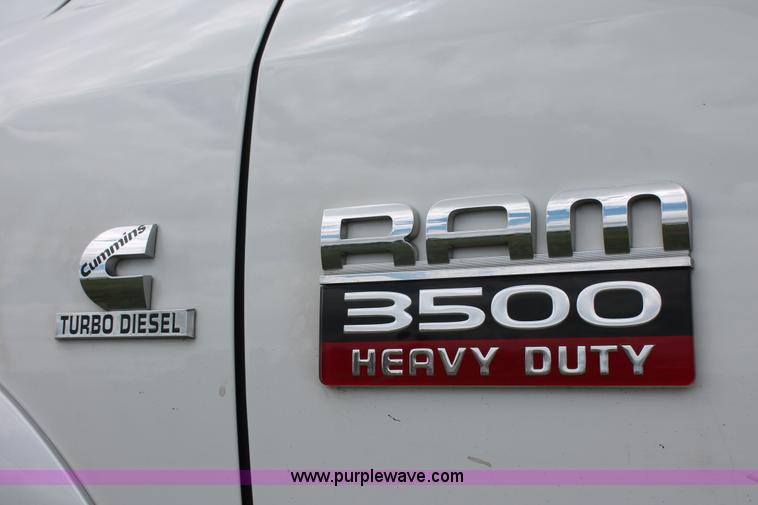 image for item K8910 2012 Dodge Ram 3500HD Laramie Quad Cab flatbed pickup truck