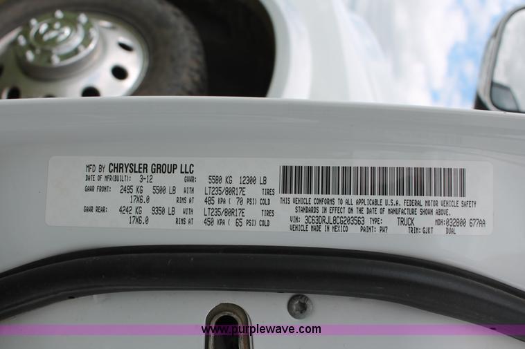 image for item K8910 2012 Dodge Ram 3500HD Laramie Quad Cab flatbed pickup truck