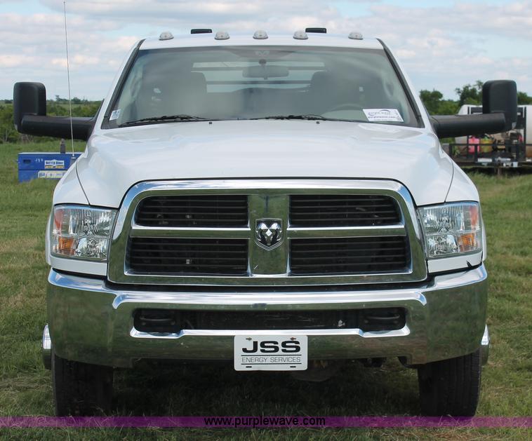 image for item K8911 2012 Dodge Ram 3500HD Quad Cab flatbed pickup truck