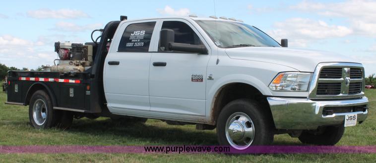 image for item K8911 2012 Dodge Ram 3500HD Quad Cab flatbed pickup truck